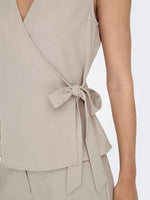Nina wrap top zwart of beige